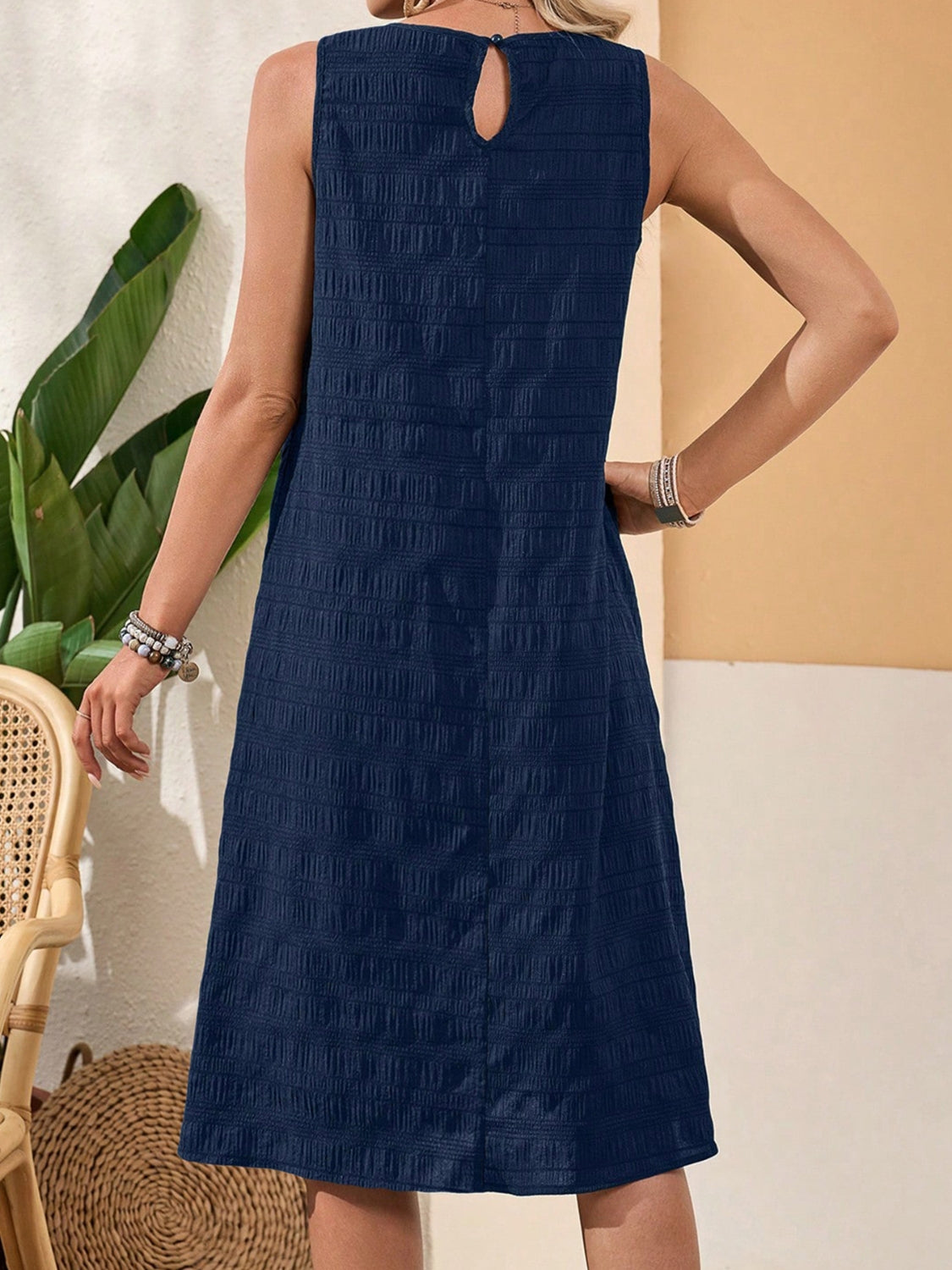 Ruffled Textured Round Neck Sleeveless Dress.