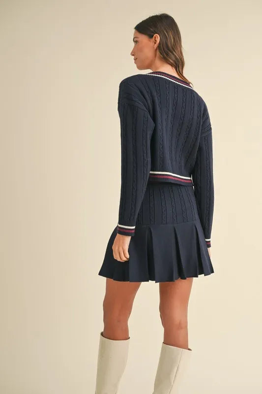 MABLE Cable-Knit Top and Pleated Skirt Sweater Set.