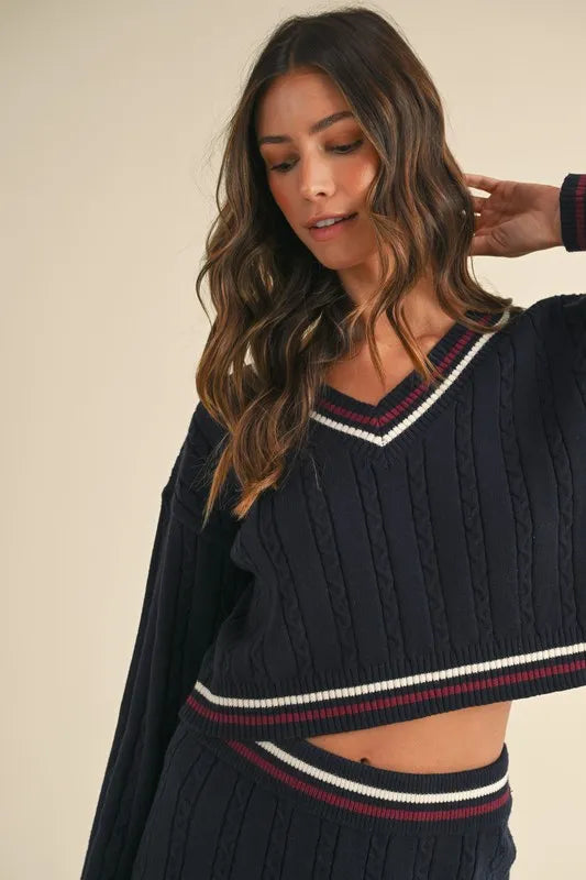 MABLE Cable-Knit Top and Pleated Skirt Sweater Set.