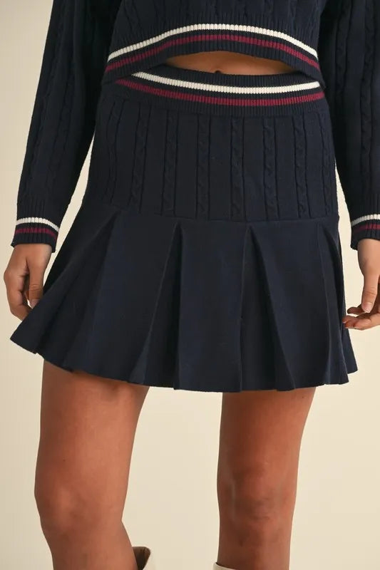 MABLE Cable-Knit Top and Pleated Skirt Sweater Set.