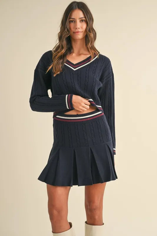MABLE Cable-Knit Top and Pleated Skirt Sweater Set.