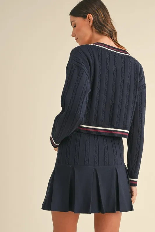 MABLE Cable-Knit Top and Pleated Skirt Sweater Set.